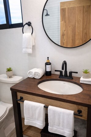 Shower, hair dryer, towels, soap