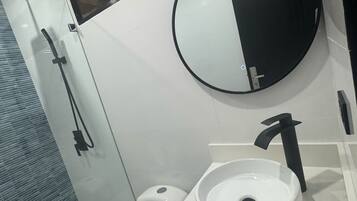 Shower, towels, soap, toilet paper