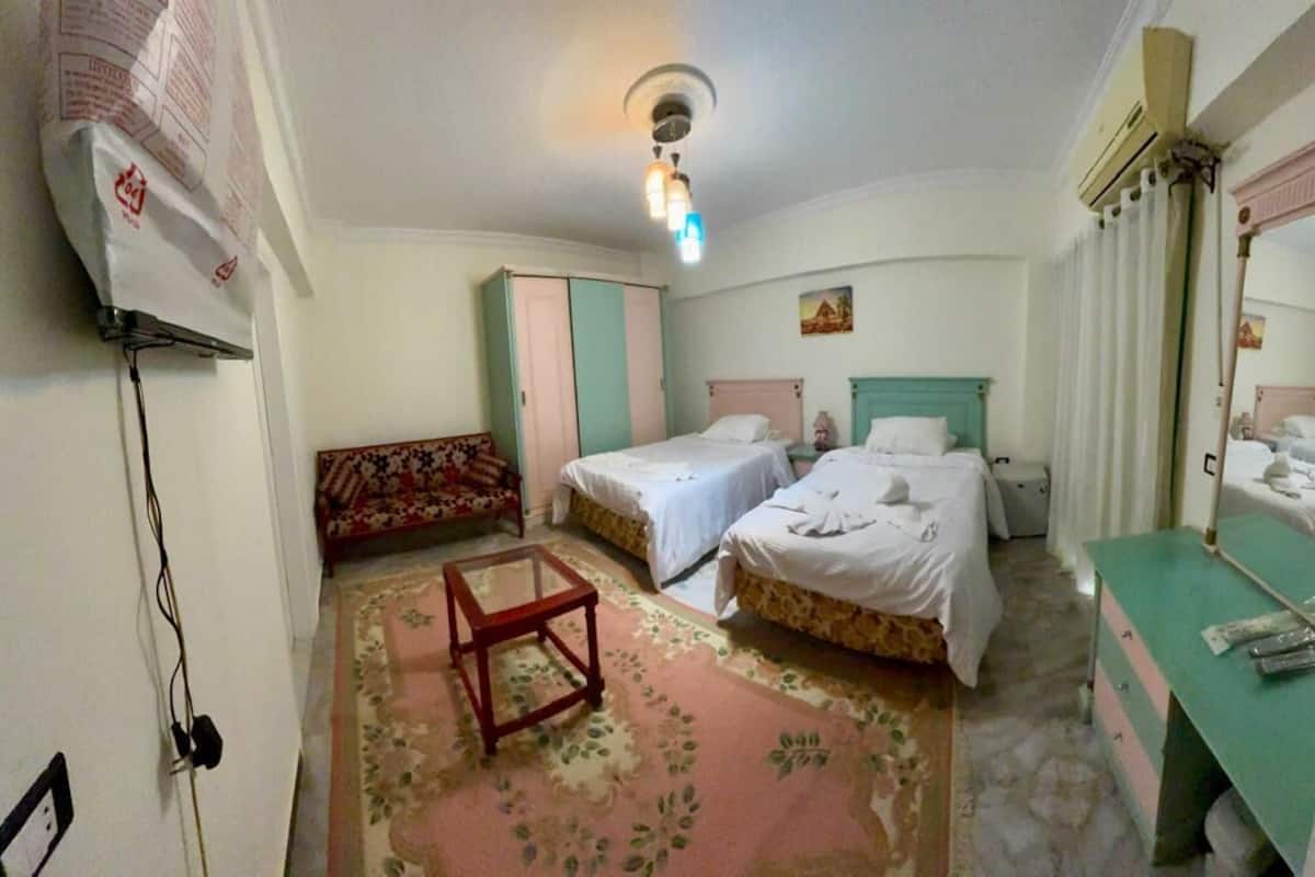 Comfort Room, Balcony, City View | Minibar, bed sheets