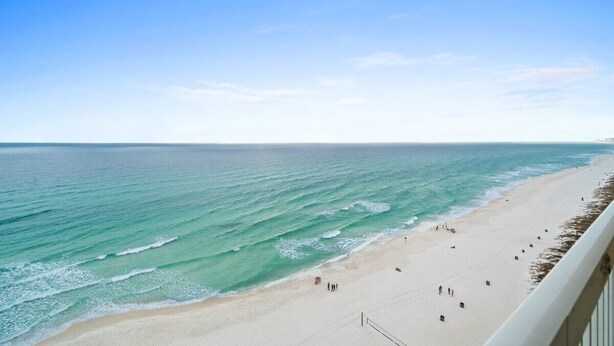 A beach with clear blue water and a sandy shore. - Fall Deals + Snowbird Rates | Gulf Front Beach Escape (Panama City Beach)