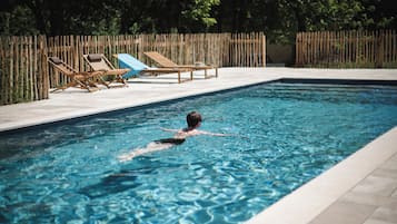 Seasonal outdoor pool, open 9:00 AM to 9:00 PM, pool umbrellas