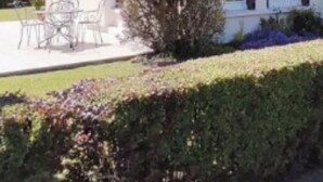 A two-story house with a tiled roof, a front porch with chairs, and a well-maintained garden. - Charming house close to the beach and Mers les bains (Criel-sur-Mer)