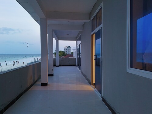 Beachfront Zanzibar Escape – 2BR Suites with AC & WiFi, Uroa