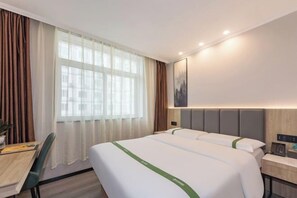 A hotel room with two beds, a desk, and a chair. - GreenTree Inn Smart Choice Hotel (Beijing West Railway Station north square) (Beijing)