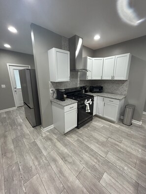 Microwave, oven, stovetop, dishwasher - Modern 2-bedroom house in Columbus with modern amenities, and private backyard. (Columbus)