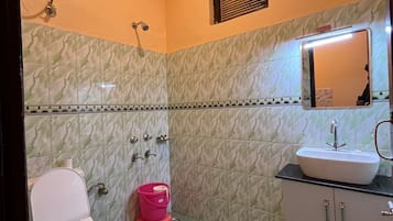 Shower, free toiletries, slippers, towels