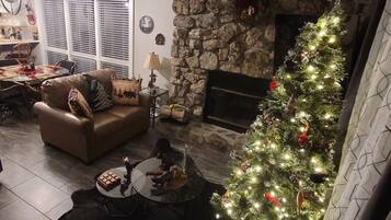 65-inch LCD TV with digital channels, fireplace, Netflix