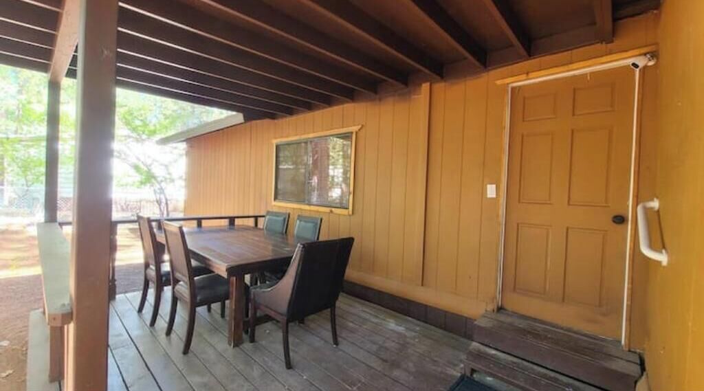 Backyard with covered patio.