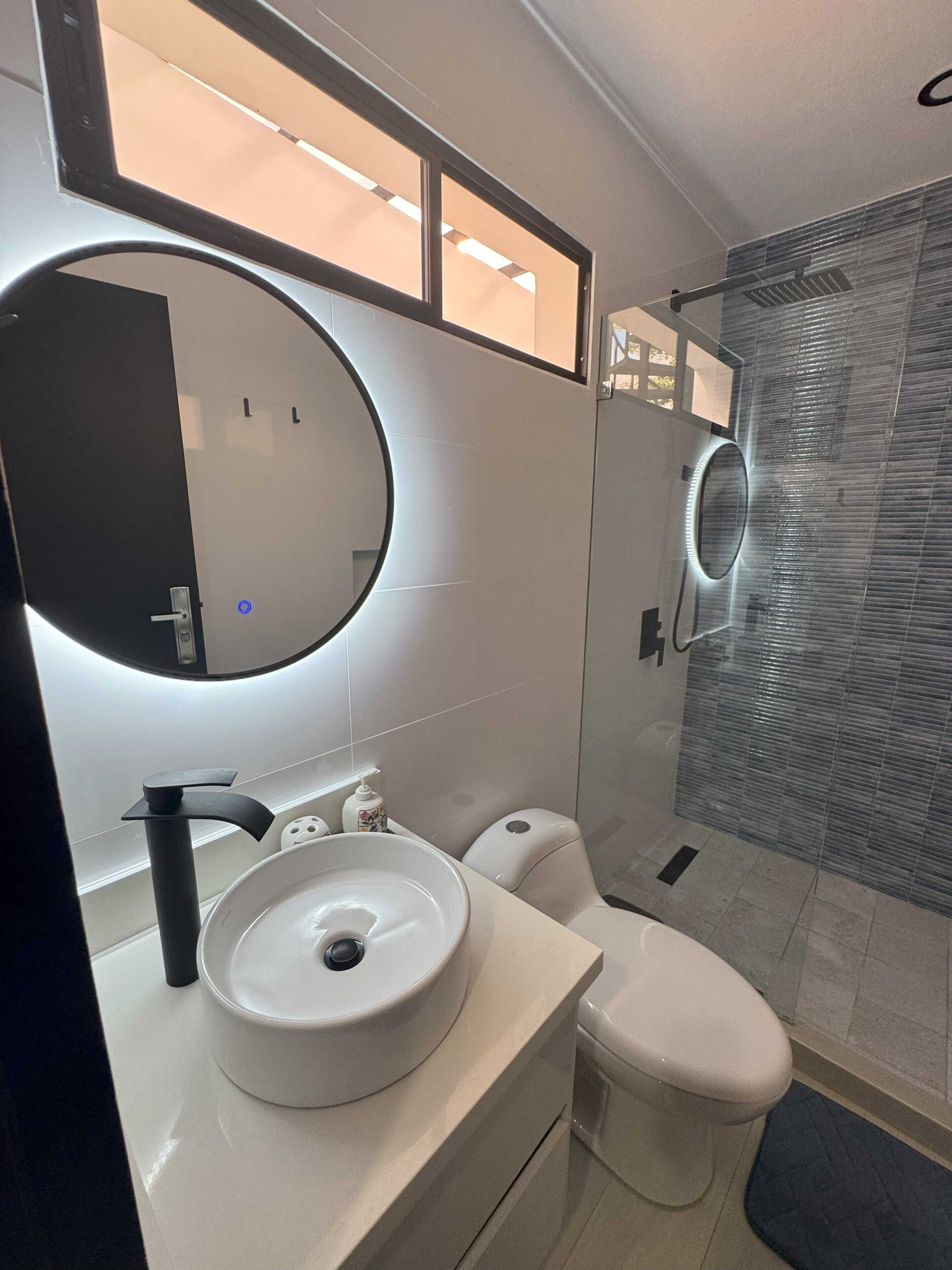 Shower, towels, soap, toilet paper