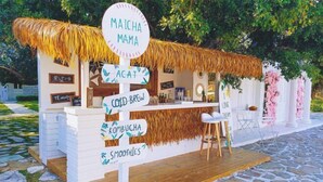 A food stall with a signboard listing items like 'Maicha Mama', 'Acai', 'Cold Brew', 'Kombucha', and 'Smoothies'. - Shenzhen Xiyong Resort (Shenzhen)