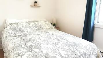 1 bedroom, desk, iron/ironing board, travel crib