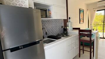 Microwave, coffee/tea maker, blender, cookware/dishes/utensils