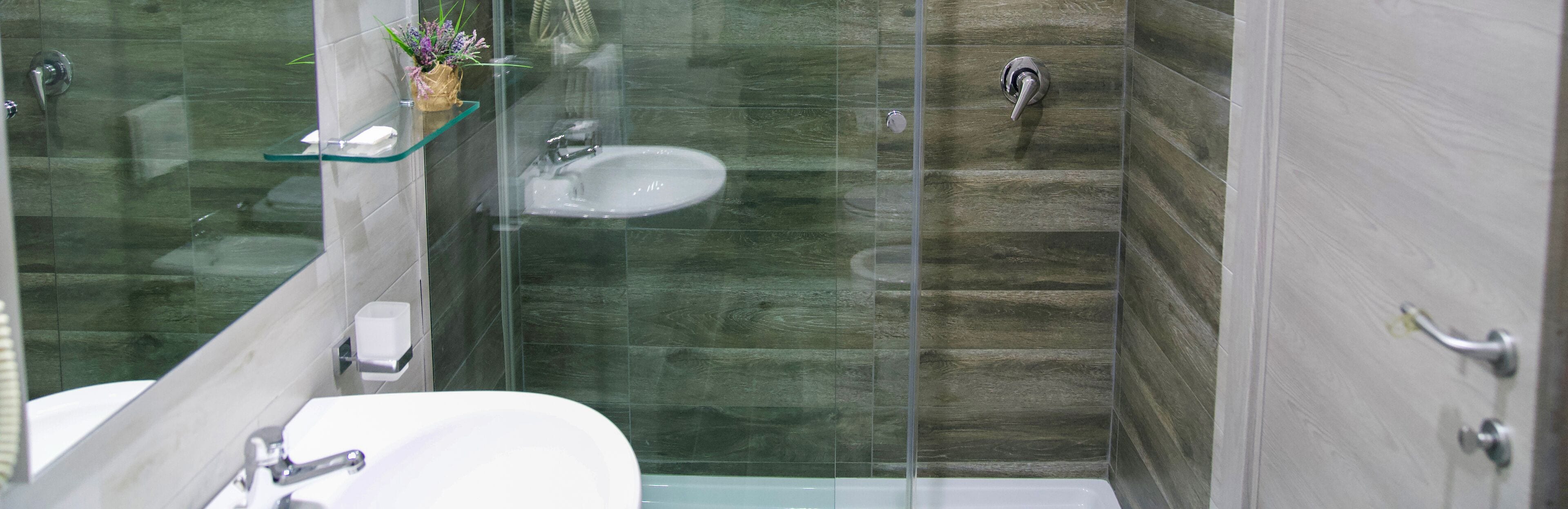 Classic Triple Room | Bathroom | Rainfall showerhead, designer toiletries, hair dryer, slippers