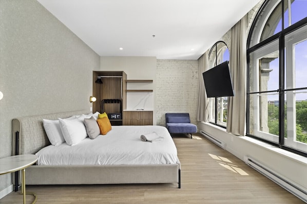 1 bedroom, desk, iron/ironing board, travel crib