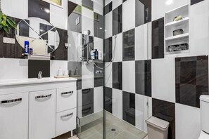 Shower, hair dryer, towels, soap