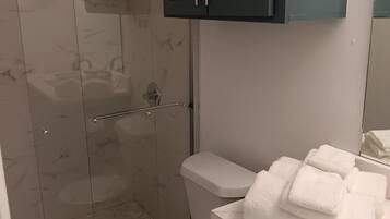 Shower, hair dryer, towels, soap