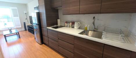 Fridge, microwave, stovetop, coffee/tea maker