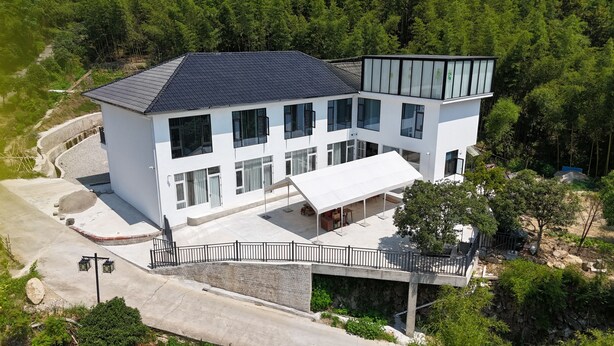 A modern two-story building with a flat roof, large windows, and a covered outdoor area. - Lafite Apple B&B (Hangzhou)
