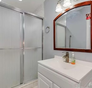 Shower, hair dryer, towels, soap