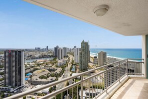 A high-rise building with a view of the ocean and cityscape. - Crown Towers Resort - Luxury Apartment (Surfers Paradise)