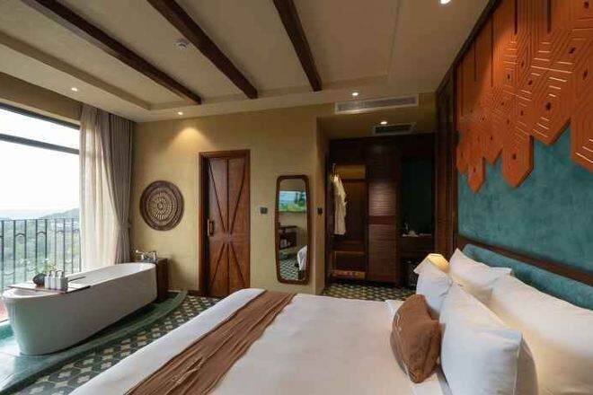 Luxe beddengoed, een minibar met enkele gratis items