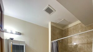A bathroom with a toilet, sink, and bathtub. - Cjay Homes (Jersey City)