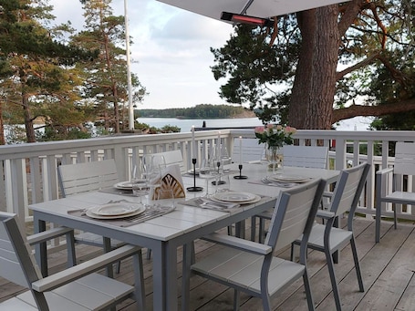Outdoor dining. Kapteenin huvilat by Interhome