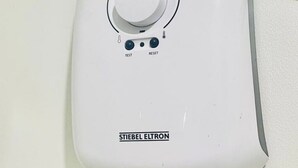 A white wall-mounted device with a dial, two buttons labeled 'TEST' and 'RESET', and a label reading 'STIEBEL ELTRON'. - MARIA CONDO 19F Cebu High-Rise (Mandaue City)