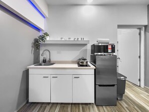 Fridge, microwave, stovetop, coffee/tea maker