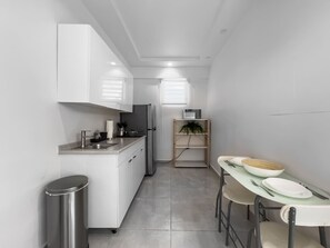 Fridge, microwave, stovetop, coffee/tea maker