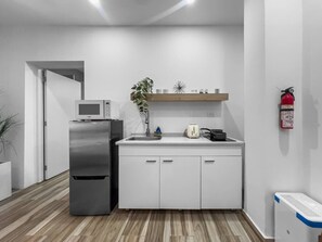 Fridge, microwave, stovetop, coffee/tea maker