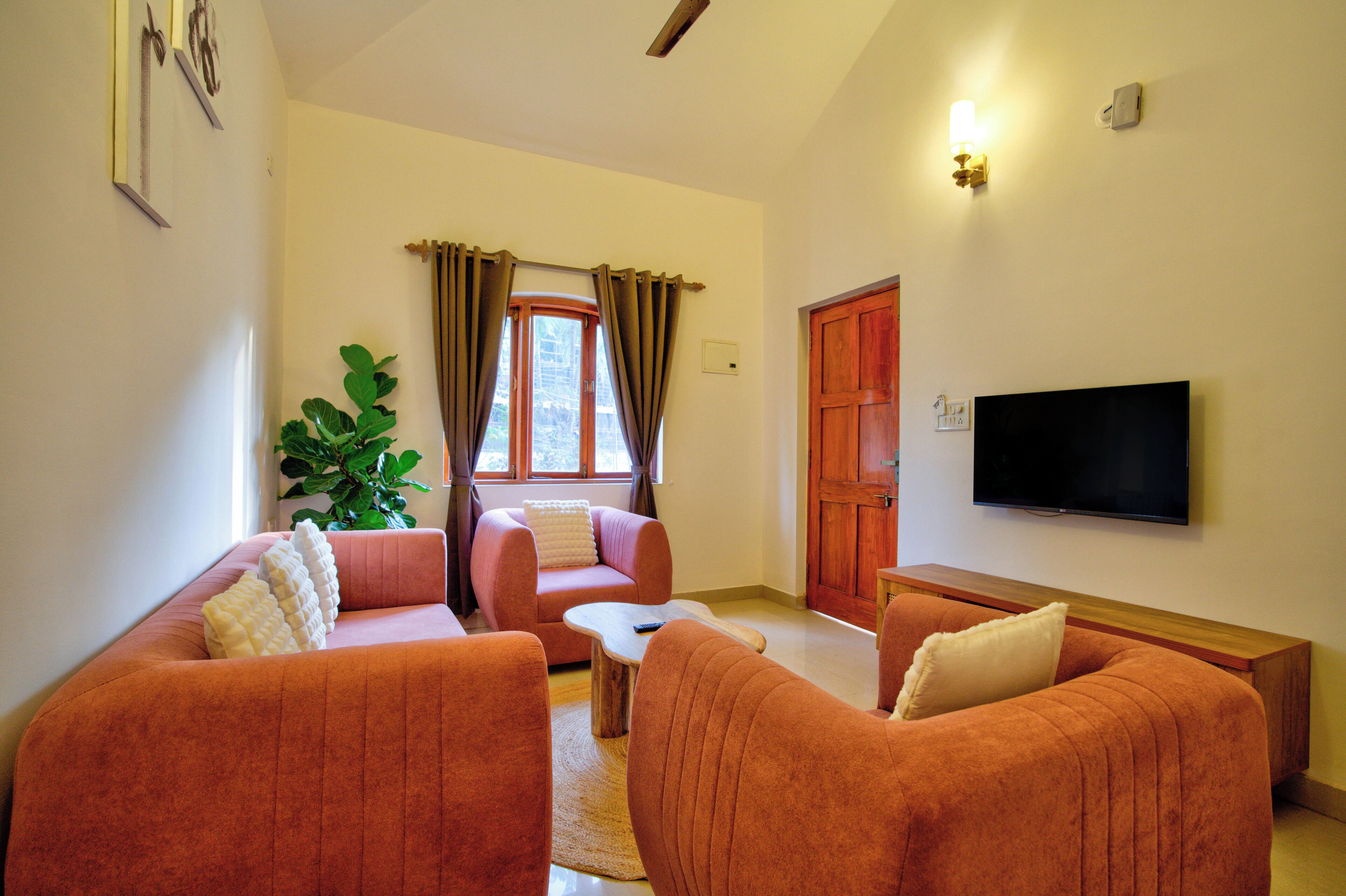 Family Villa, Pool View | Living area | 32-inch flat-screen TV with satellite channels