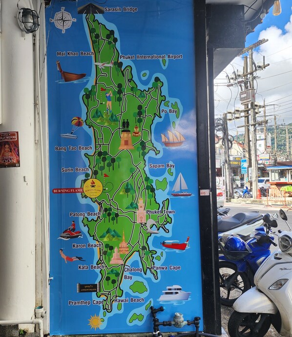 A colorful map of Phuket with marked beaches and landmarks. - Burning Flame Hotel Patong (Patong)