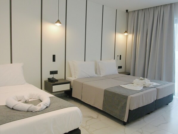 Deluxe Triple Room, Balcony | In-room safe, laptop workspace, soundproofing, free WiFi - Oros Paradise Hotel (Rhodes)