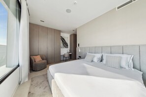 A modern bedroom with a large bed, a desk, and a chair. - Club Villa - Modern and Serviced 4 bedroom Villa on the Croatian coast (Ugljan)