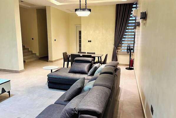 Luxury Apartment, Balcony, City View | Living area | Flat-screen TV