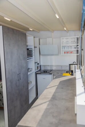 Fridge, microwave, stovetop, coffee/tea maker