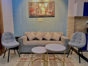 Deluxe Double or Twin Room, Balcony | Living area | 42-inch LED TV with digital channels - GET DREAM INN (Noida)