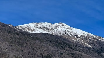 A snow-capped mountain with a clear sky.