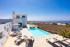 A rooftop pool with lounge chairs, a small building, and a view of the coastline. - The View in T as With 4 Bedrooms and 4 Bathrooms (Tías)