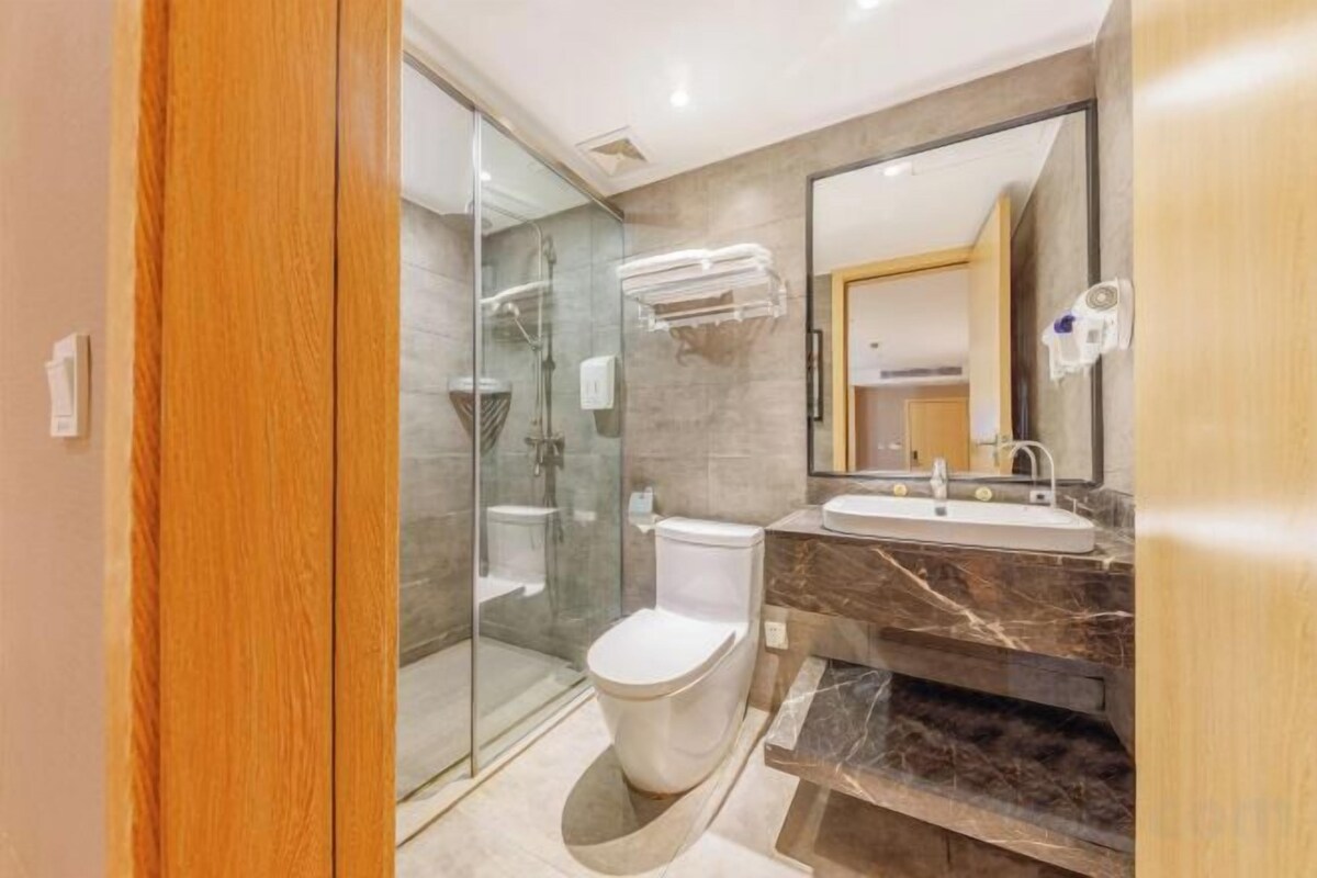 Bathroom | Shower, hair dryer, slippers, towels