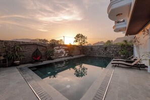 Outdoor pool, open 7:00 AM to 9:30 PM, pool umbrellas