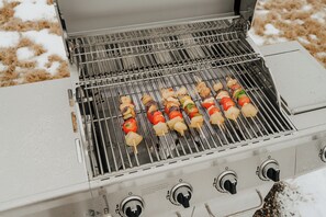 A grill with skewers of vegetables and meat. - Onyx Ridge · Breathtaking Views · 14 Acres (Jeffersonville)