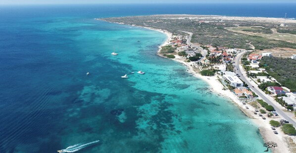 Beach nearby, white sand, sun loungers, beach umbrellas