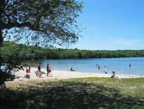 A beach with people swimming and relaxing. - Adorable Updated Cottage, Walk to Water! (Yarmouth)
