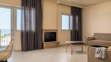 Family Apartment, 1 Bedroom | Living area | 32-inch flat-screen TV with digital channels