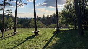 A grassy field with tall trees and a clear sky. - Albergo Villa San Michele  (Greve in Chianti)