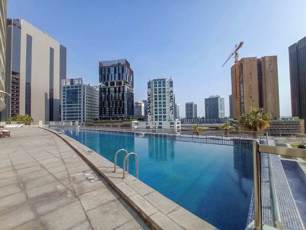 Pool - StayShort - Relaxing and Cozy 1BR Apartment in Business Bay! (Business Bay)