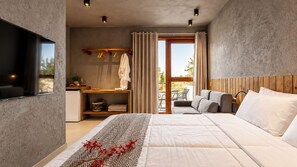 A modern bedroom with a large bed, a desk, and a view of the outdoors. - Oribá Chalé Boutique (Sao Miguel dos Milagres)
