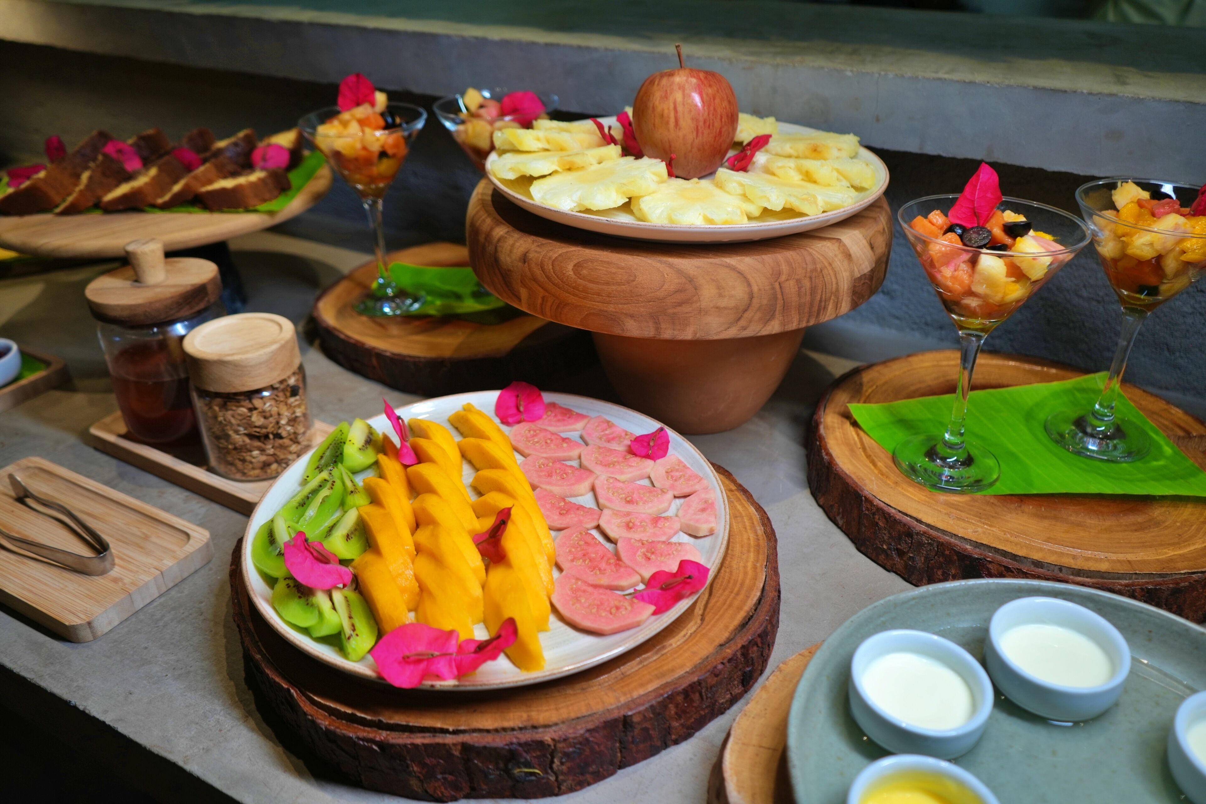 A buffet with various food items and drinks.